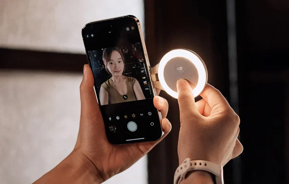 PGYTech MagGlow phone light in gray mounted on a smartphone
