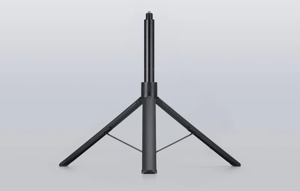Селфі-палиця DJI Osmo з вбудованим розкладеним штативом на сірому тлі
