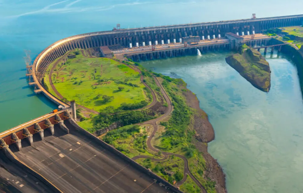 Dam with a large reservoir and a green peninsula in the middle