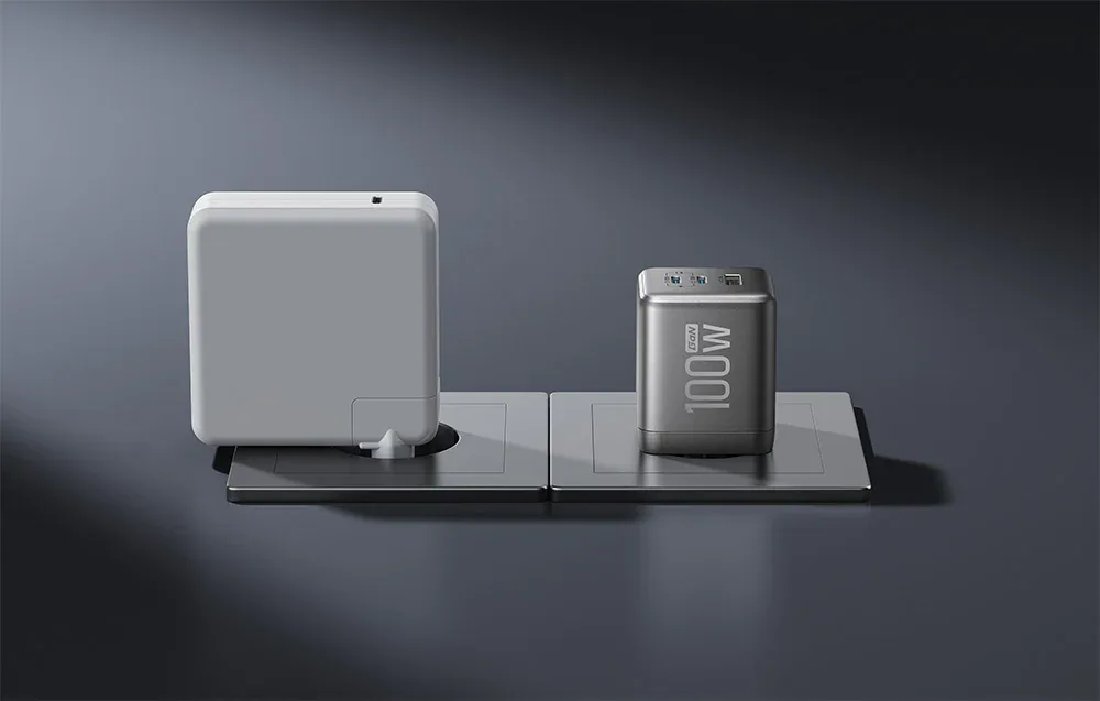 Compact EcoFlow RAPID Pro 100W GaN charger next to a larger white charger