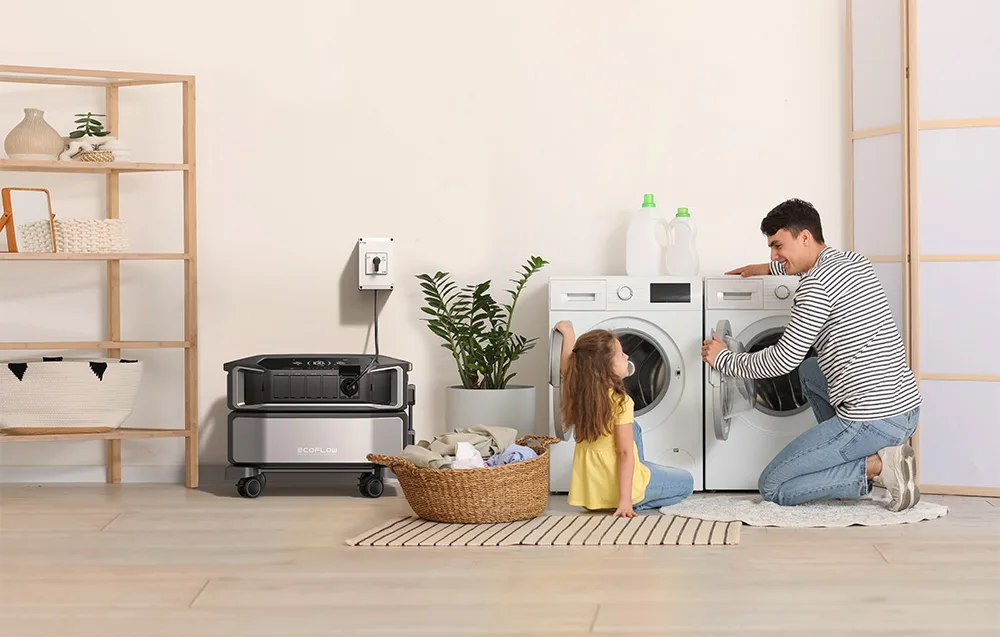 Father and daughter standing near washing machines beside an EcoFlow backup power station in a bright room