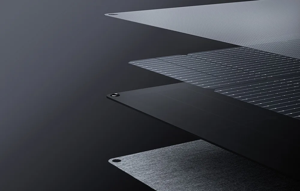 Layered construction of a portable solar panel on dark background