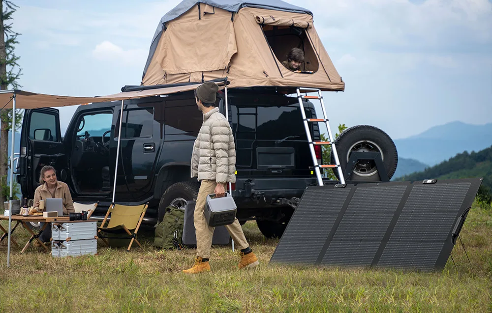 Camping scene with car, rooftop tent, people, and deployed solar panel