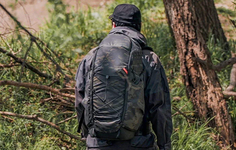 Person walking through the forest with the PGYTECH OnePro ST backpack