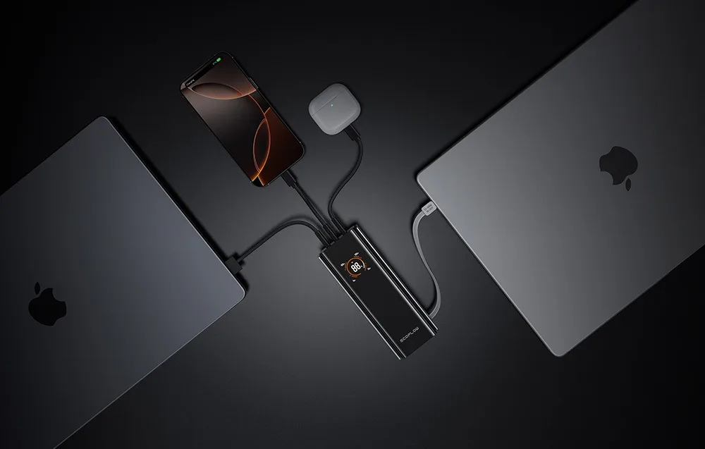EcoFlow RAPID Pro power bank connected to two laptops, a smartphone, and TWS earbuds.