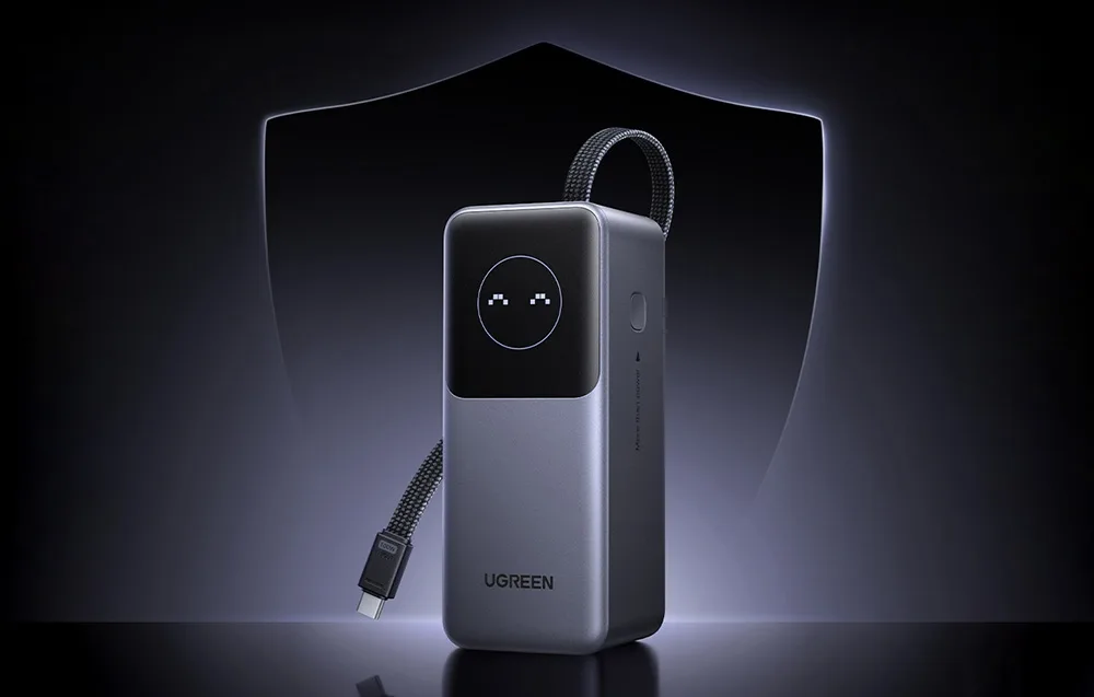 Ugreen PB723 power bank standing in front of a shield symbolizing protection