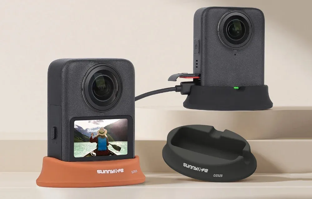 DJI Osmo 360 cameras placed on black and orange Sunnylife stand bases