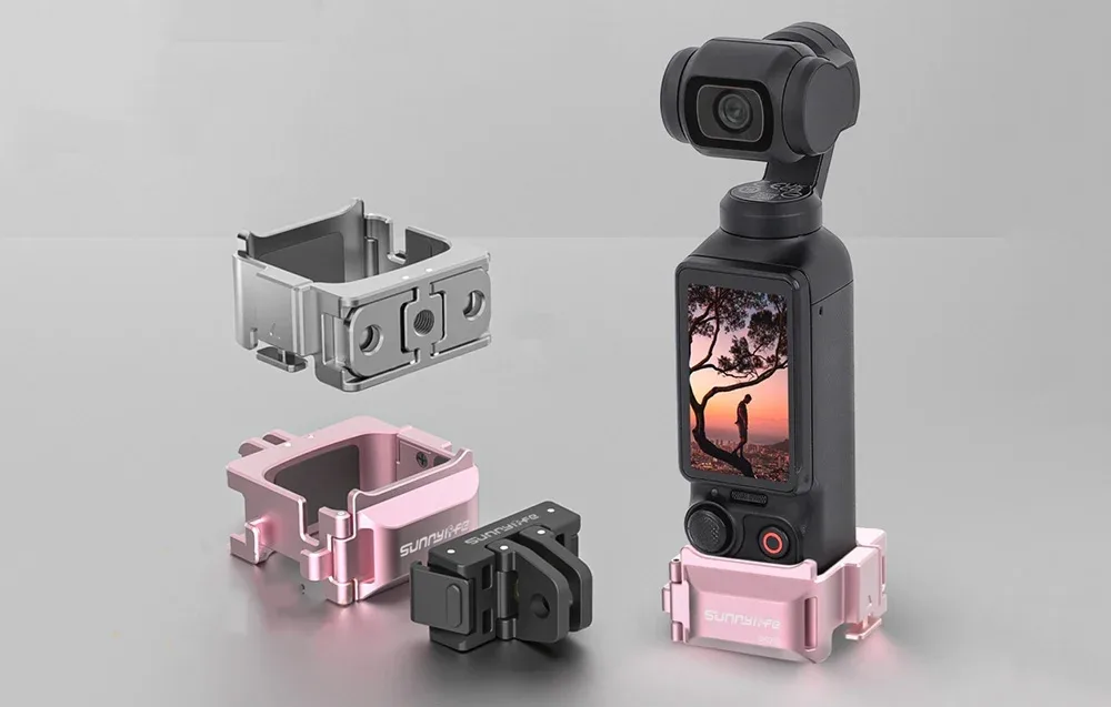 Kamera DJI Pocket w różowym uchwycie Sunnylife, obok trzy różne wersje metalowych mocowań w kolorach srebrnym, różowym i czarnym
