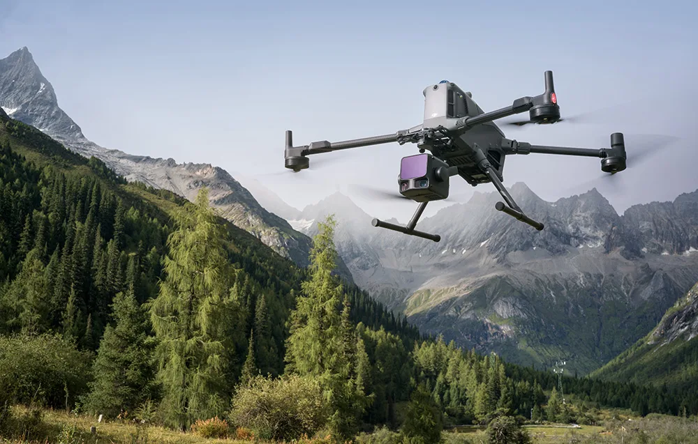 DJI drone with Zenmuse L3 camera flying above forests and mountains