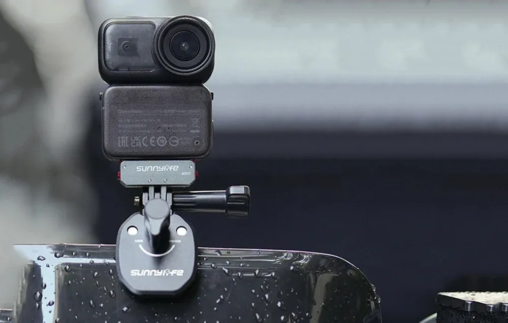 DJI action camera mounted on the SunnyLife adapter attached to a wet surface