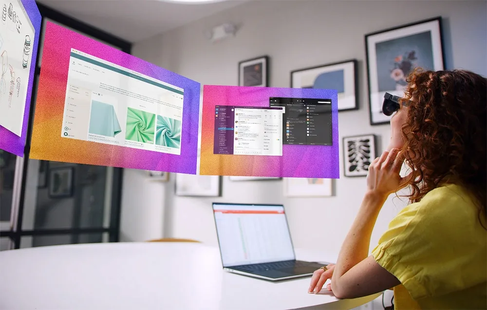 Woman wearing VITURE XR Luma augmented reality glasses looking at floating virtual screens and apps