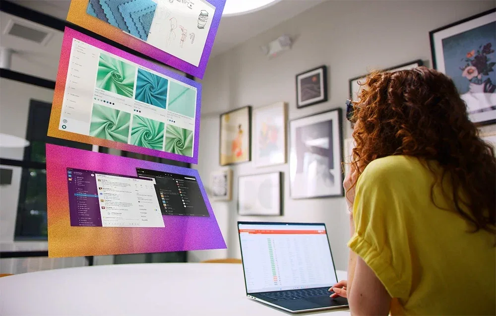 Woman working at a desk with a laptop and VITURE XR Luma Ultra glasses