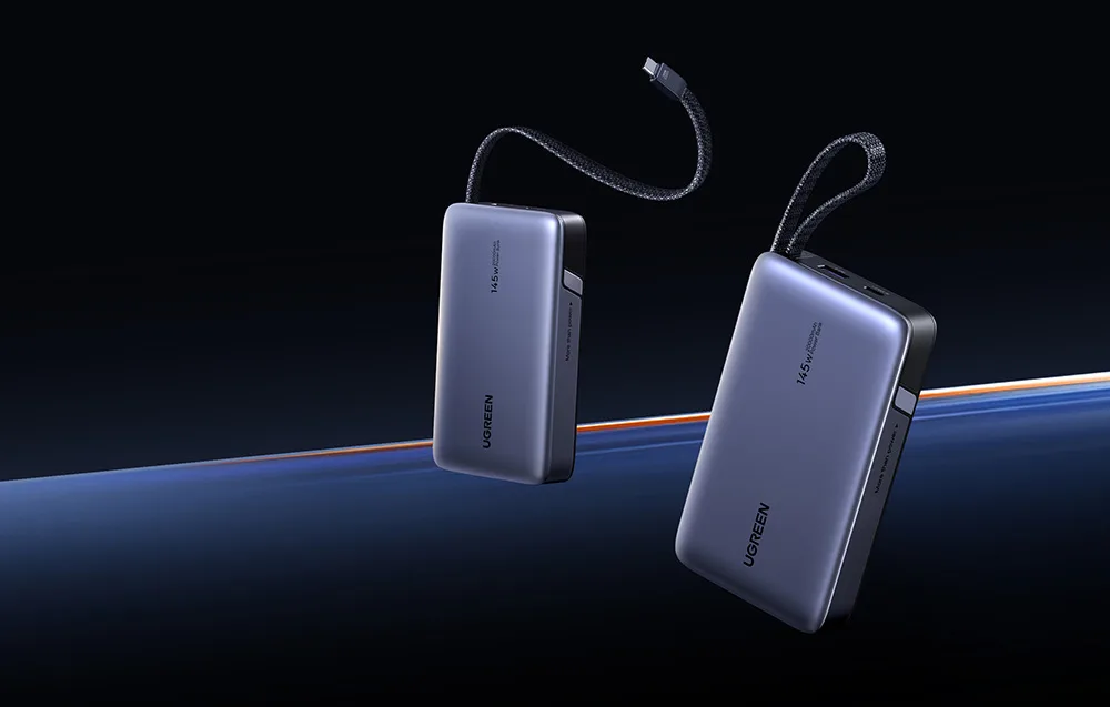 Two gray UGREEN power banks with built-in cables on a dark background