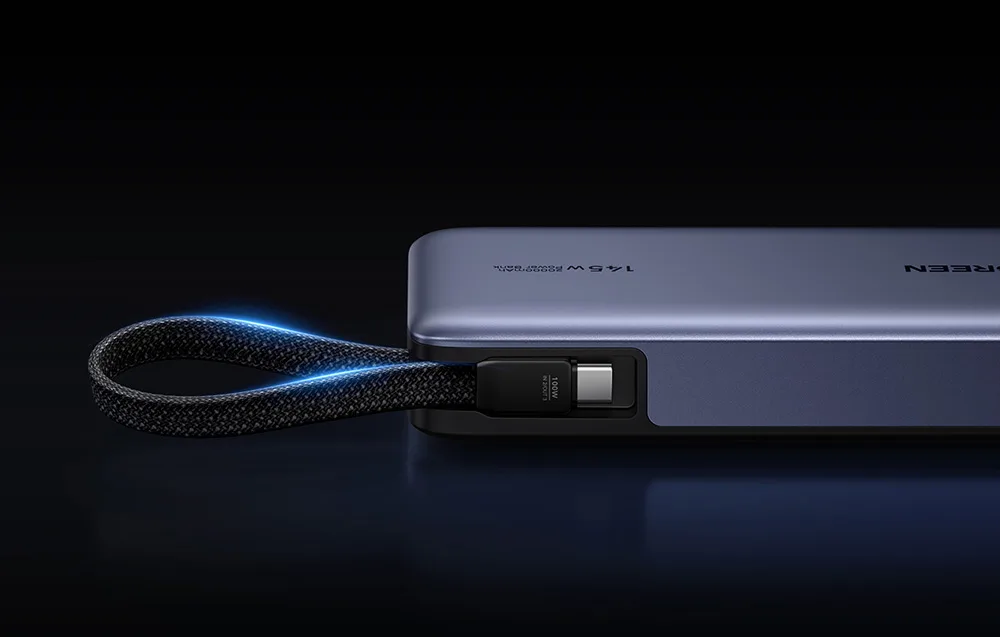 UGREEN power bank with built-in USB-C cable on a black background