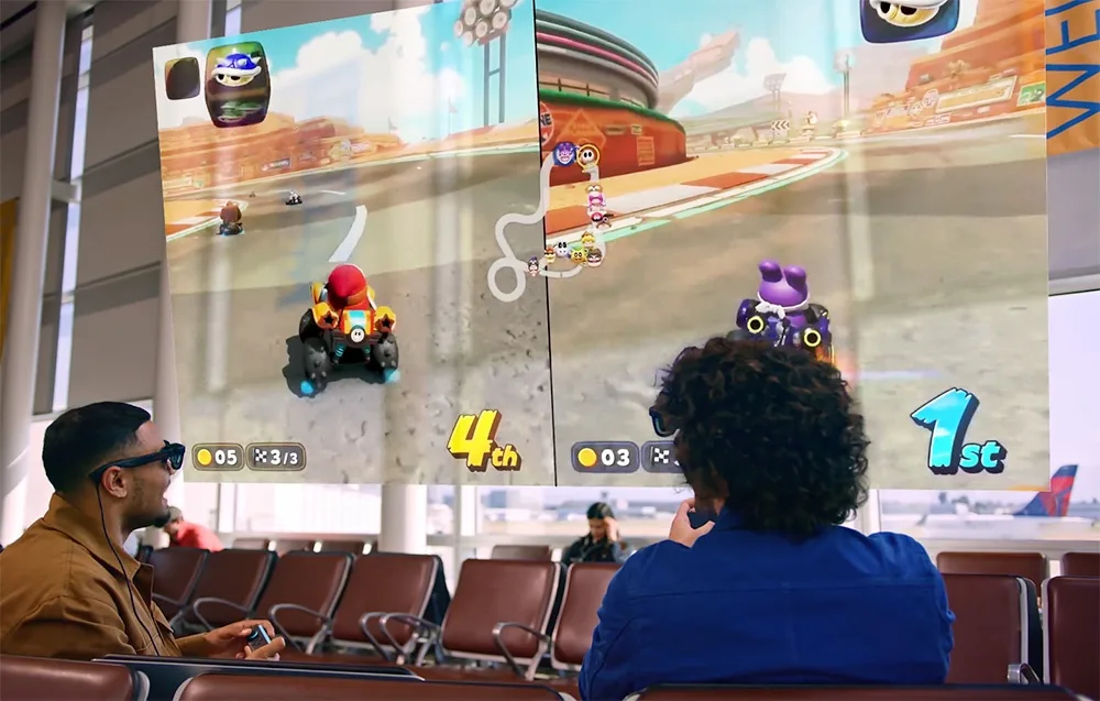 Two men wearing VITURE XR Luma Pro glasses playing a racing game on a large virtual screen