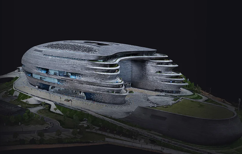 model 3D dużego szarego budynku w otoczeniu zieleni na czarnym tle