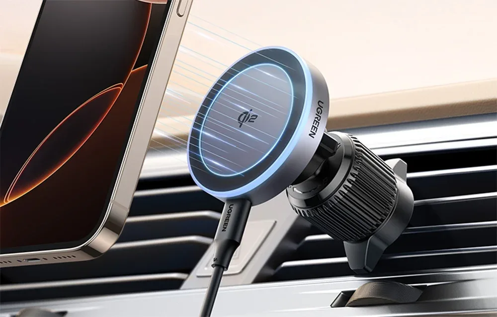 UGREEN W708 magnetic wireless car charger mounted in a car