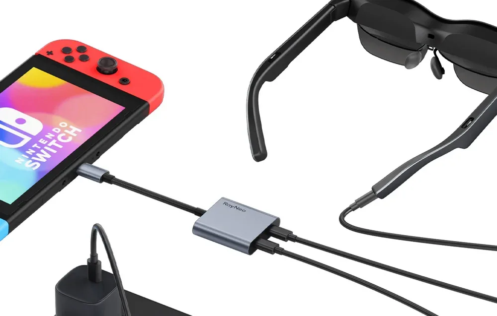 Konsola Nintendo Switch podłączona do inteligentnych okularów RayNeo za pomocą adaptera USB-C i kabla zasilającego.