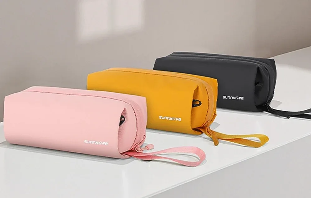 Sunnylife camera bags in different colors placed side by side on a white surface