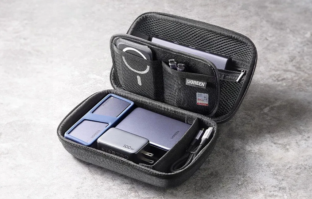 UGREEN LP152 travel organizer on a gray table with accessories inside