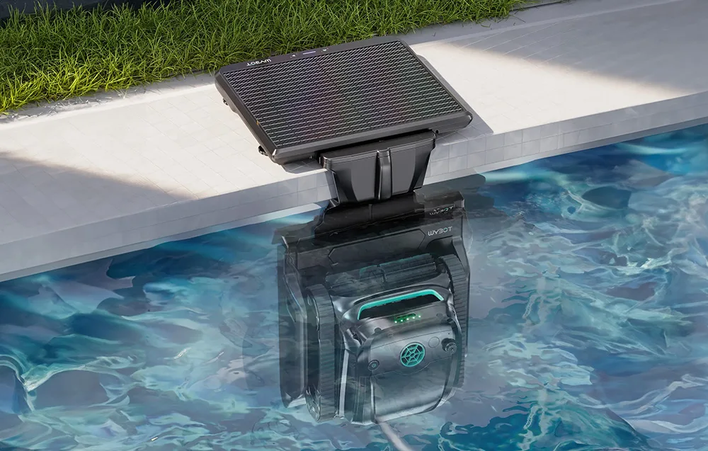Wybot S2 Solar pool cleaning robot charging at a dock by the pool edge