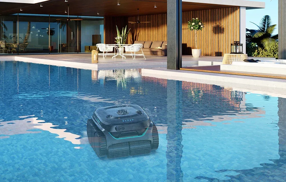 Wybot C2PRO cordless pool cleaning robot cleaning the floor of a modern outdoor swimming pool