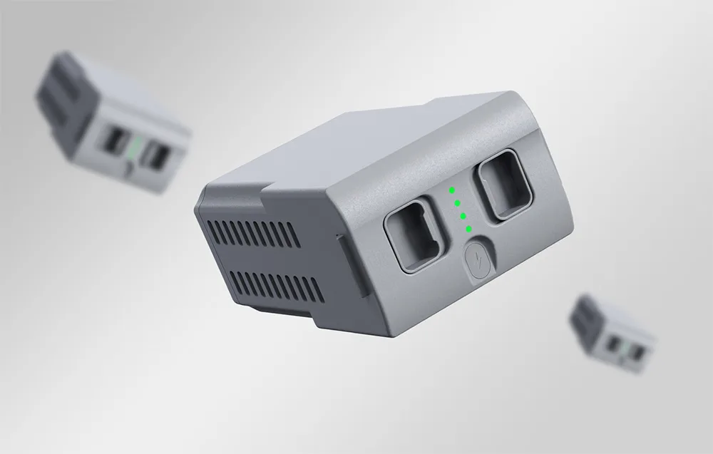 Three Unitree G1 batteries on a gray background