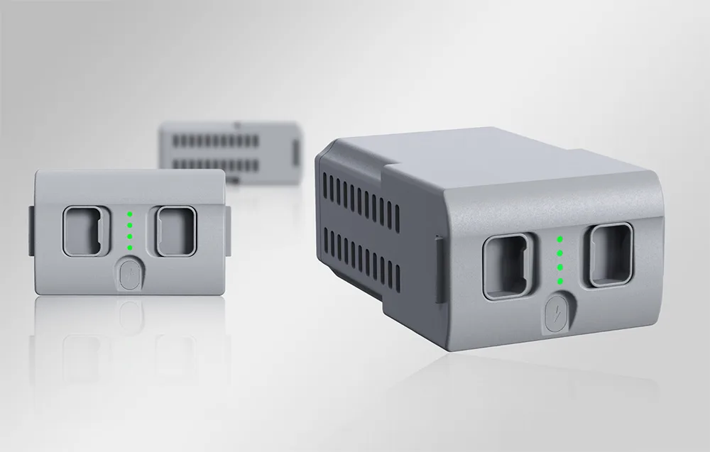 Three batteries for the Unitree G1 robot on a gray background