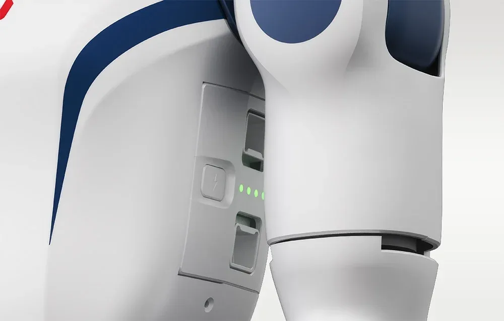 Three Unitree R1 batteries on a gray background