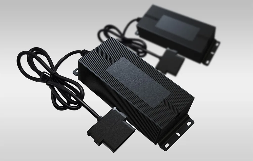 Two black UNITREE A2 chargers on a gray background