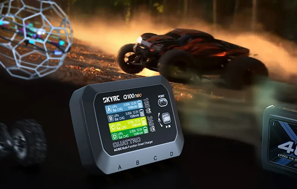 SkyRC Q100neo charger placed next to an RC car and battery pack.
