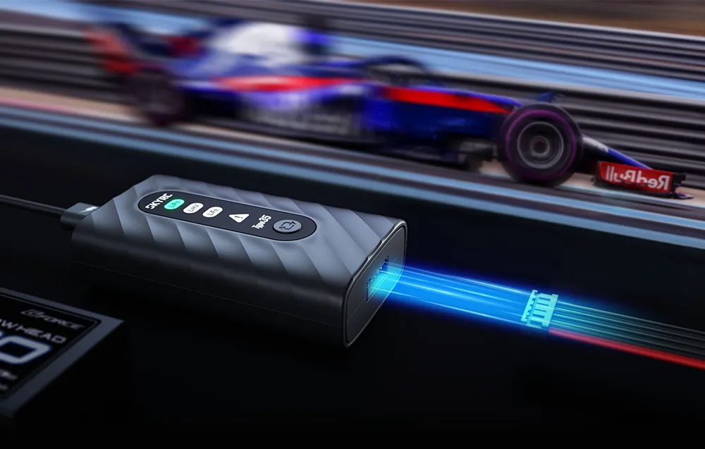 SkyRC Type35 charger with a balance lead connected, shown with an RC racing car in the background.