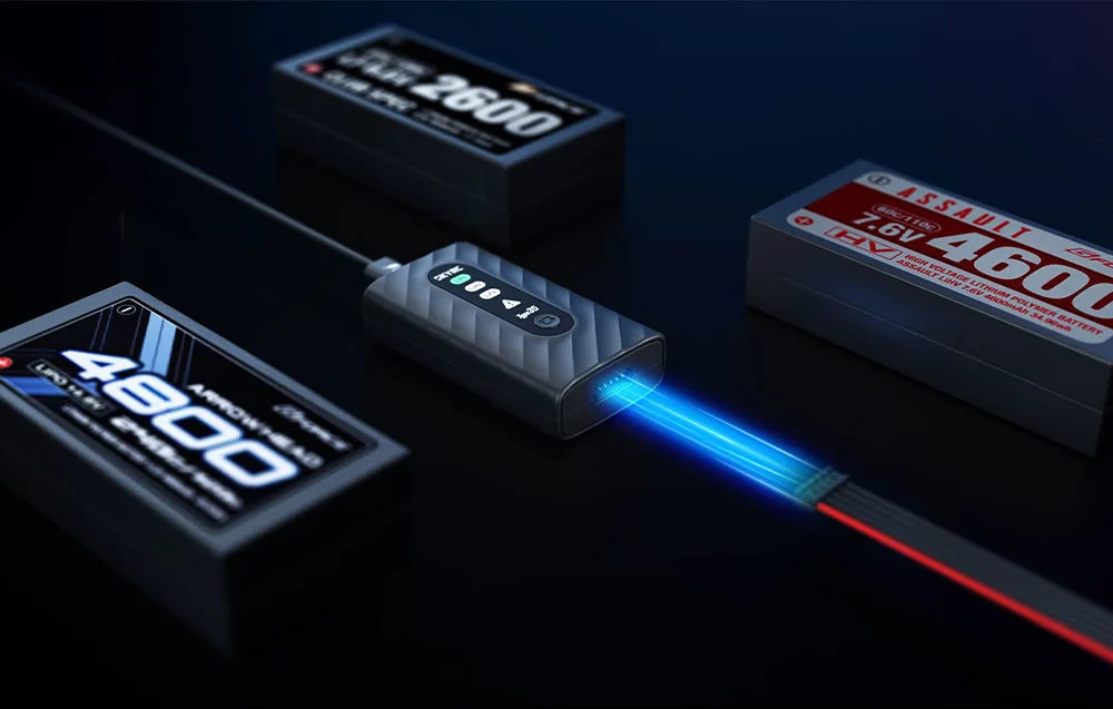 SkyRC Type35 charger connected to a LiPo battery pack next to several batteries.