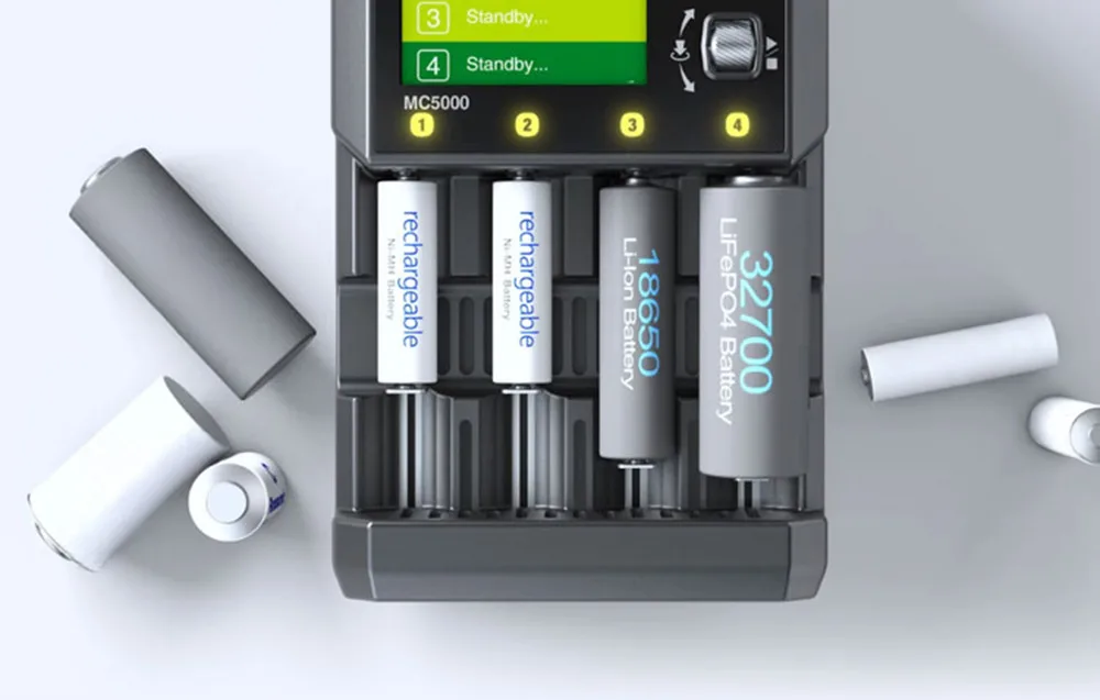 Top view of SkyRC MC5000 charger with four cylindrical batteries on a light background
