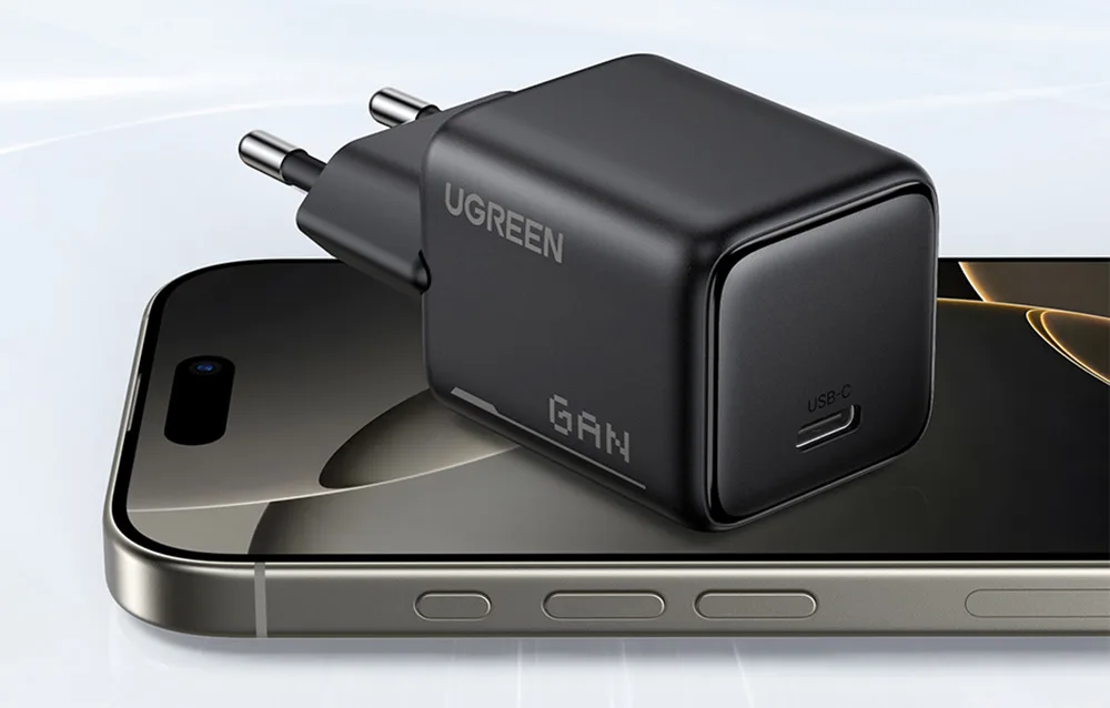 Black Ugreen X517 charger placed on a smartphone