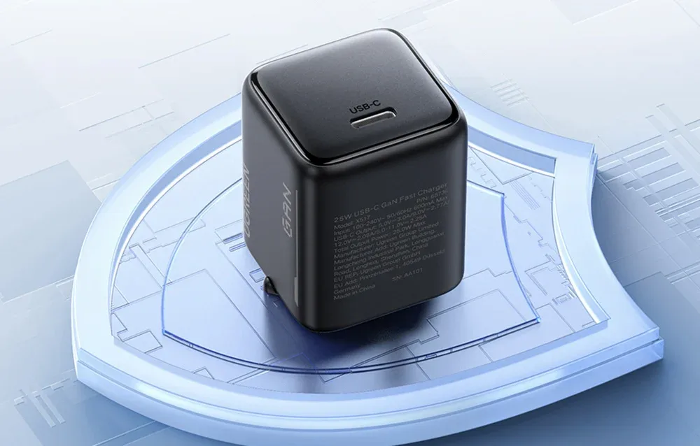 Black Ugreen X517 USB-C charger on a blue display stand