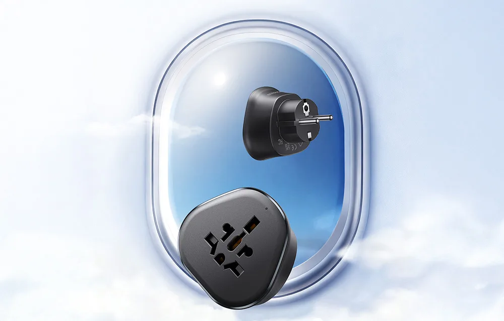 UGREEN S500 universal travel adapter shown in a travel setting near an airplane window.