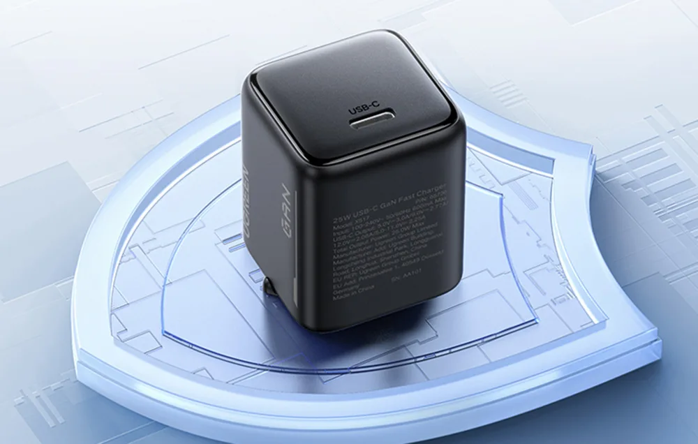 Black UGREEN 25W GaN charger with USB-C port displayed on a blue circular platform