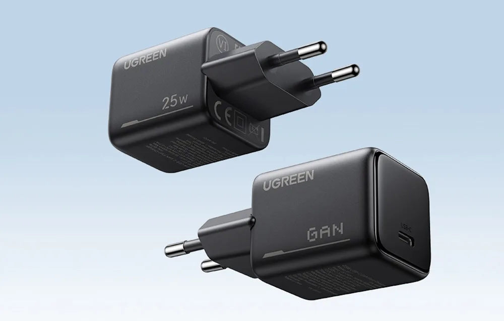 Two black UGREEN 25W GaN wall chargers with EU plug and USB-C port on a light background