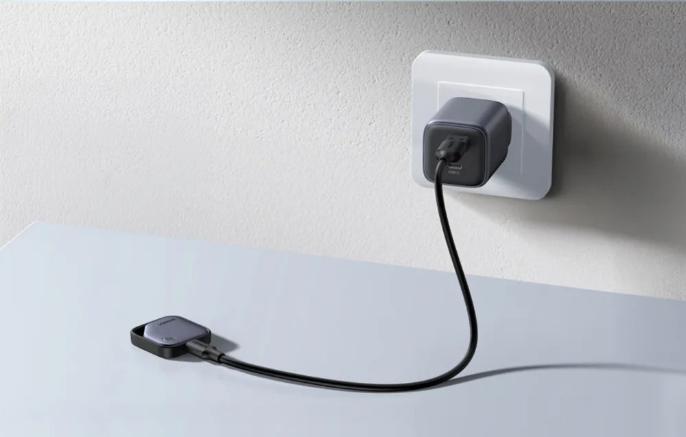 UGREEN Smart Finder connected to a wall charger with a USB-C cable.