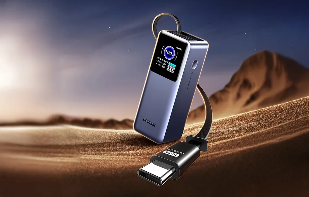 Ugreen PB726 20000mAh power bank with built-in USB-C cable on sandy dunes