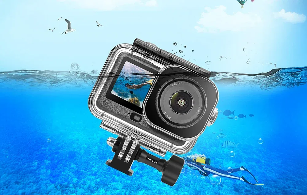 DJI Osmo Action 6 camera in Puluz waterproof housing partially submerged in the sea with a diver in the background