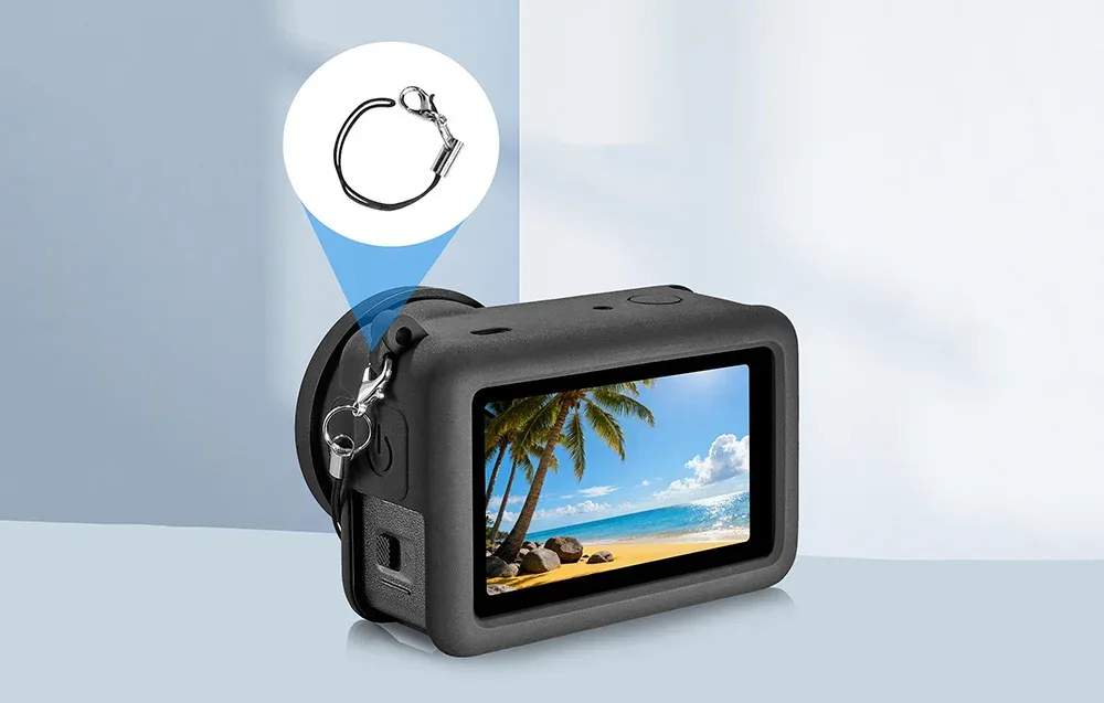 DJI Osmo Action 6 in a protective case with attached metal ring and beach view displayed on the screen