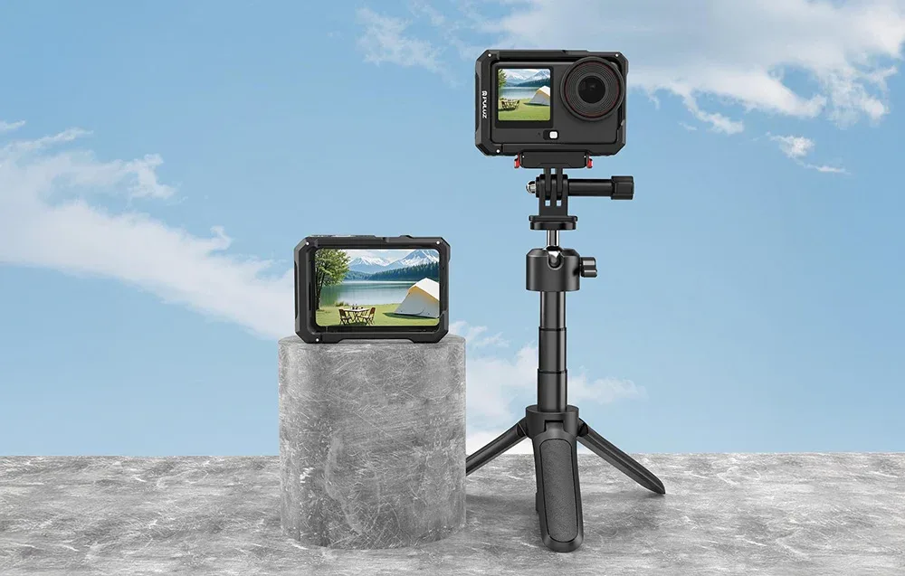 DJI Osmo Action camera in a metal protective cage mounted on a tall tripod against the sky.