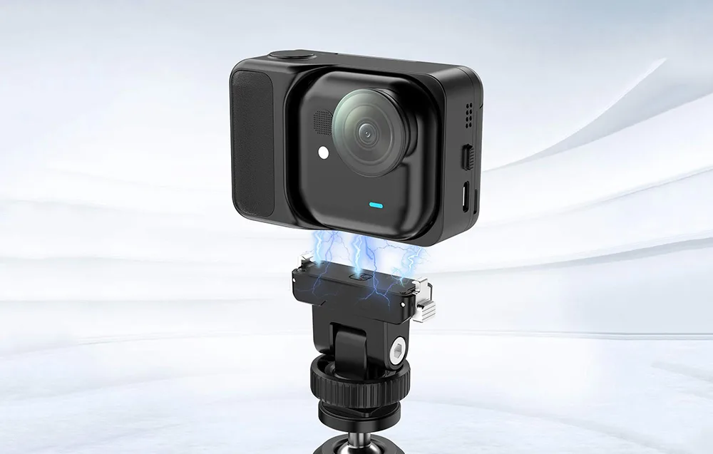 Insta360 GO Ultra camera hovering above the Puluz adapter with visible magnetic attachment effect