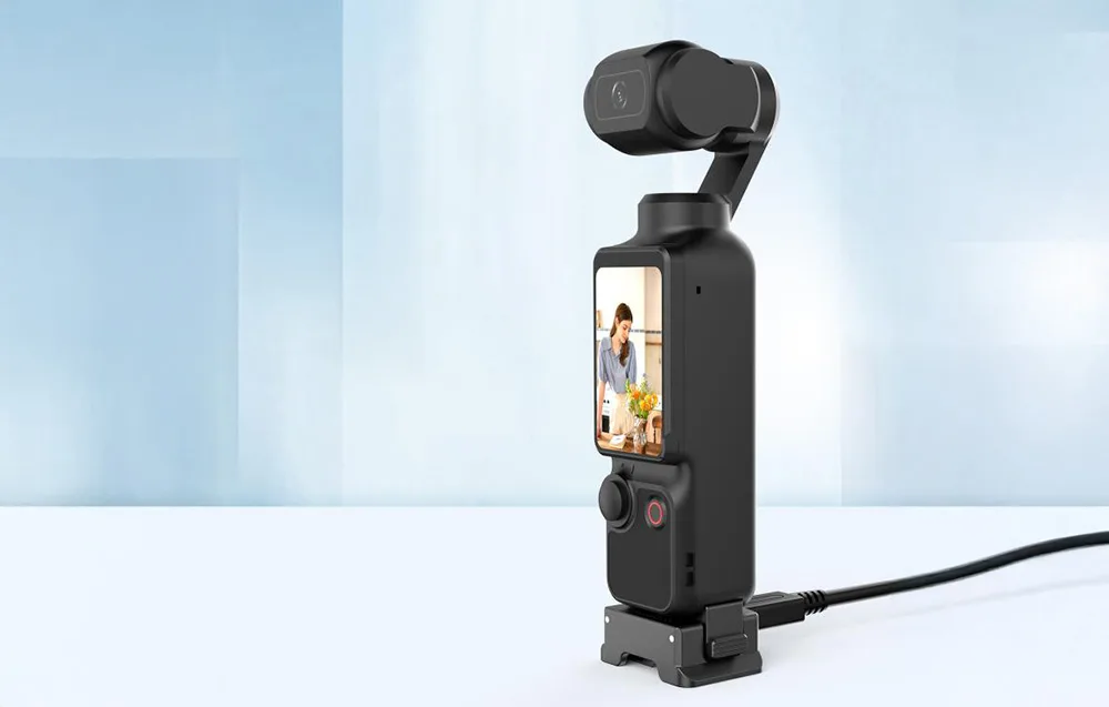 Puluz quick-release charging adapter with DJI Osmo Pocket 3 camera mounted on a blue background