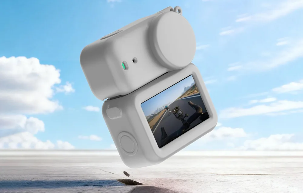 DJI Osmo Nano camera in a gray silicone protective case against a sky background