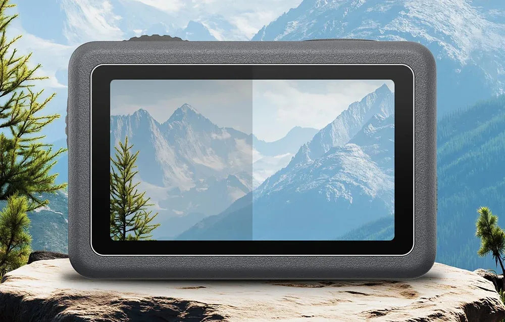 DJI Osmo Action 6 action camera against a mountain landscape
