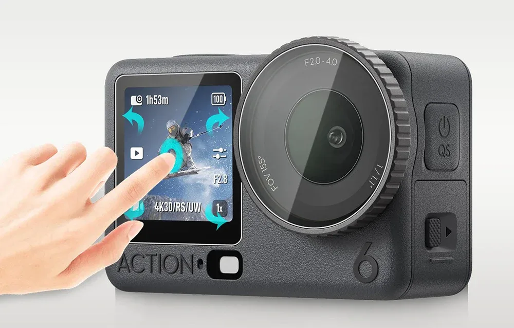Hand using the touch screen of an action camera