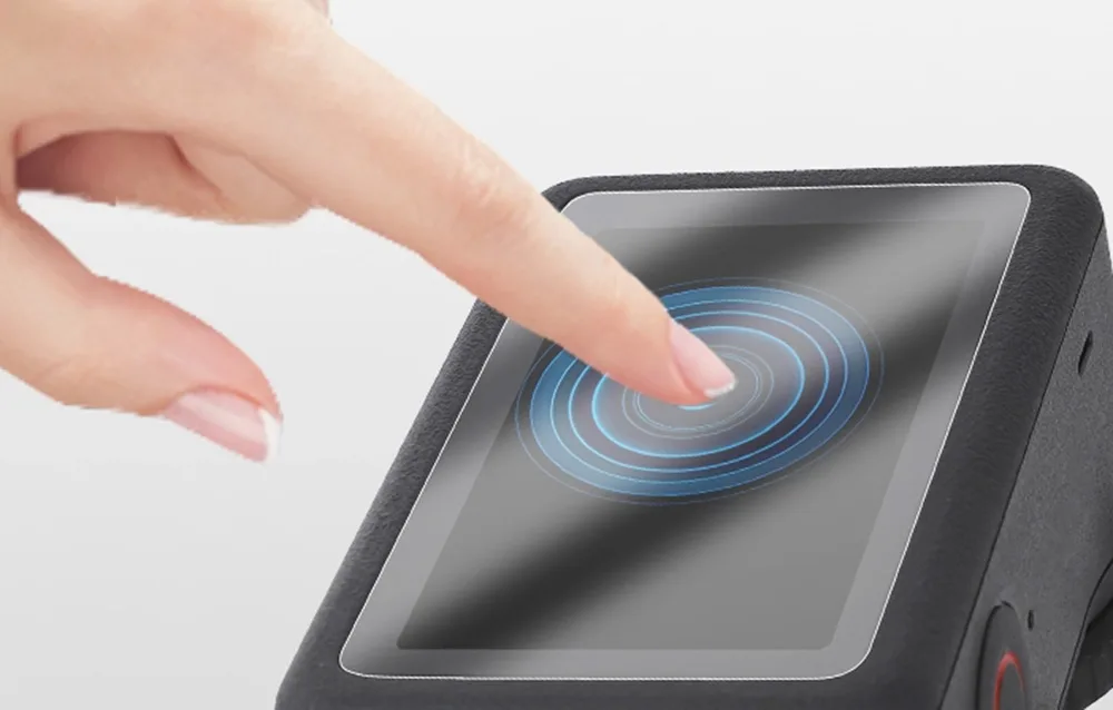 Finger using the DJI Osmo Action 6 touchscreen with Sunnylife tempered glass protector applied